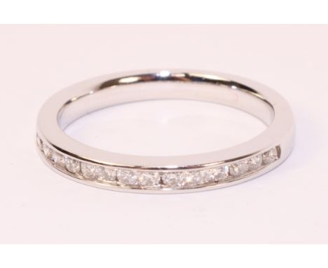 Princess cut diamond channel set half eternity 18ct white gold ring stamped 75018k   Condition Report  approx 1.25 carat diam
