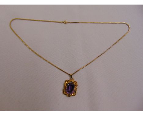 18ct yellow gold amethyst pendant on a 9ct gold chain, approx total weight 11.6g
