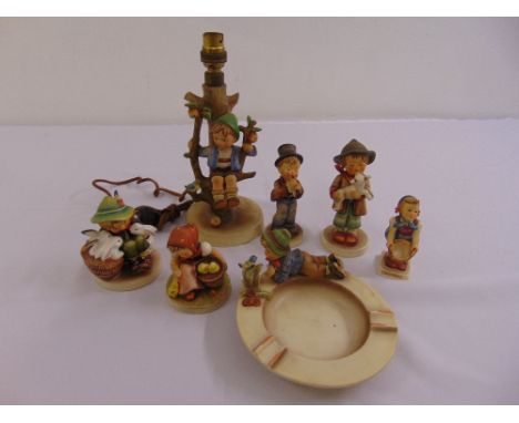 A quantity of Hummel and Goebel figurines of children to include a table lamp  (7)