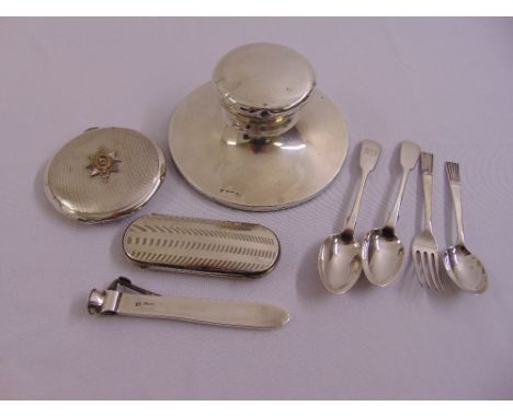 A quantity of silver to include a compact with regimental crest, capstan inkwell, spectacle case, cigar cutter and flatware  