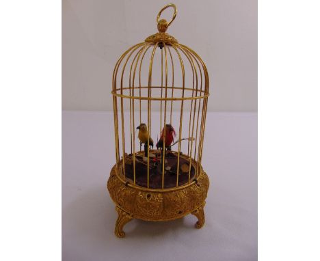 An automaton of singing birds in a gilt metal cage