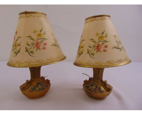 A pair of ceramic hand painted bedside lamps with decorative shades