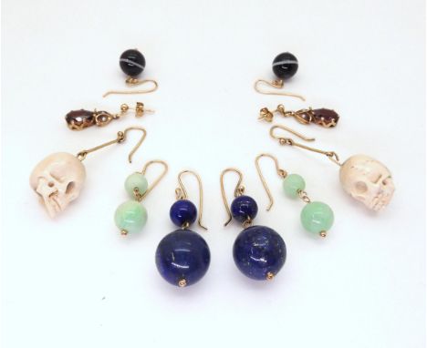 A collection of decorative earrings, to include a pair of carved bone skulls, with yellow metal earwires, a pair of 9ct gold 