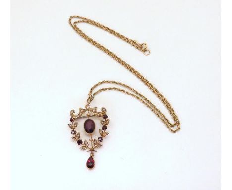 A 9ct gold Edwardian garnet and pearl pendant, length with bail 4.2cm, on a 9ct gold rope chain length 48cm, weight 5.9gms Co