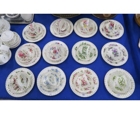 A set of twelve Royal Albert Flowers of the Month series cups and saucers, all with large side plates and seven with smaller 