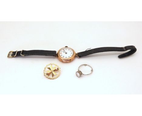 A 9ct gold ladies watch with Arabic dial, leather strap, length 21cm, a yellow metal Maltese Cross brooch, weight together 21