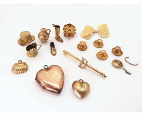 A collection of 9ct gold and yellow metal charms to include a Cuckoo clock, a cufflink and three studs etc weight together 20
