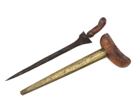 A Malay kris, the straight folded steel blade measuring approx. 34cm in length and housed in a brass clad characteristic scab