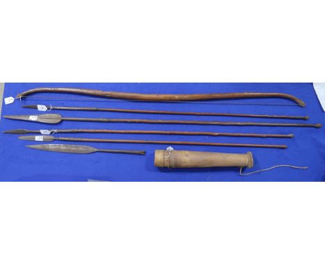 Four African tribal spears, a further unmounted elongated spearhead, a bow and a leather-clad quiver containing a number of a