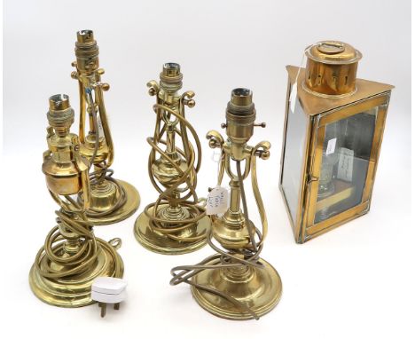 Four polished brass ship's gimble wall/table lamps, two with handwritten labels attached stating that they were removed from 