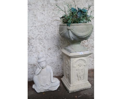 A contemporary reconstituted stone urn on a reconstituted stone base cast with cherubs, 82cm high and a contemporary reconsti