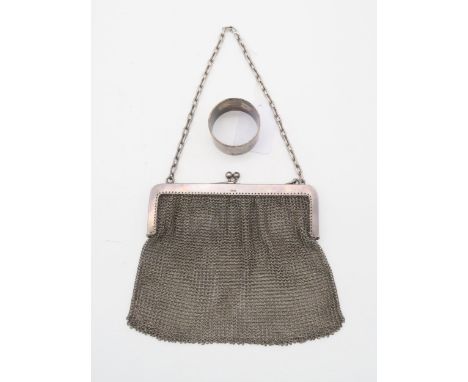 A silver chain mesh purse, with import marks for Paul Ettinger, London, and an EPNS napkin ring (2) Condition Report:Availabl