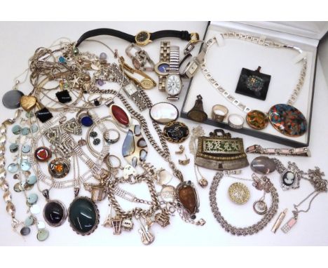 A silver and white metal charm bracelet tot include a guitar retailed by Georg Jensen, a Zuni first nation ring inlaid with g