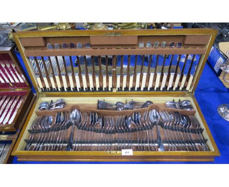 An extensive oak canteen of ivorine handled stainless steel cutlery, by R Groves &amp; Sons, comprising&nbsp; table forks and