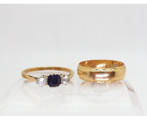 An 18ct and platinum blue and white sapphire ring, size S1/2, together with an 18ct wedding band size P1/2, weight together 6