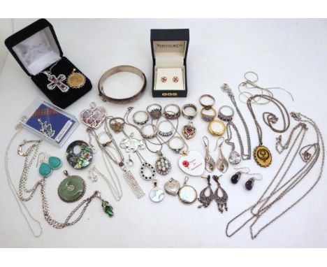 A silver bangle with Birmingham hallmarks for 1973, silver pendants one set with opal, earrings and two items by Danbury mint