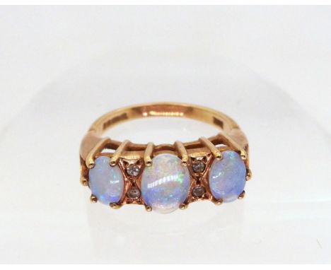 A 9ct gold opal and diamond ring, size M, weight 3.4gms Condition Report:Available upon request