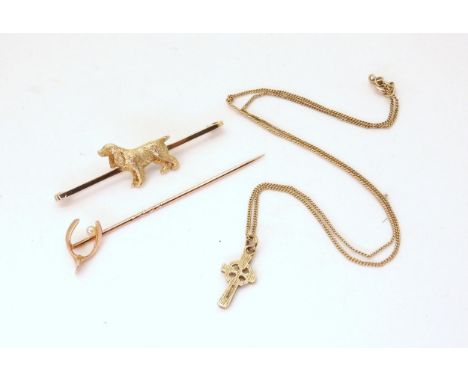 A 9ct gold spaniel dog brooch, a yellow metal and pearl wish-bone pin, together with a 9ct gold Celtic cross pendant and chai