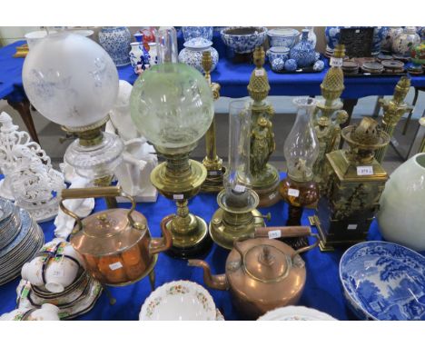 A unusual oil lamp, the brass base moulded as a brick pillar with ivy , together with four other oil lamps, two with etched s