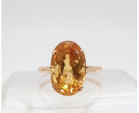 A yellow metal mounted citrine ring, finger size W1/2, weight 4.5gms Condition Report:Available upon request