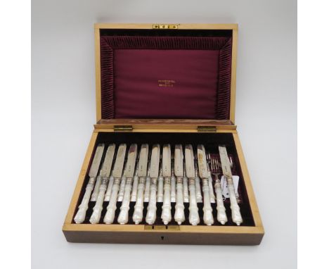 A cased set of silver bladed and mother of pearl handled fish knives and forks, (one knife and fork missing) by Walker &amp; 