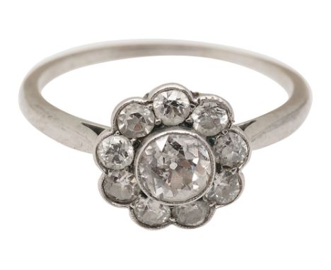 An Edwardian diamond-set cluster ring, set throughout with old brilliant-cut diamonds to the plain tapering bandring size M, 