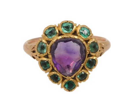 A late 18th century amethyst and emerald-set ring, the central pear-shaped amethyst within a surround of emerald-set collets,