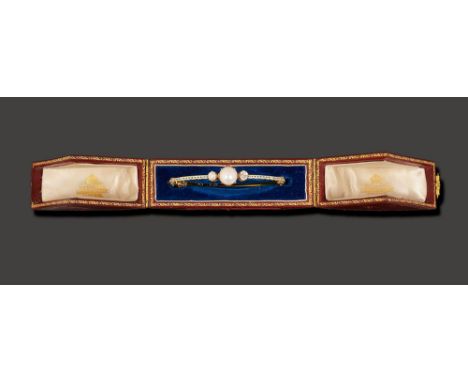 A mid/late Victorian pearl, diamond and enamel hinged bangle by Carlo Giuliano, the central pearl measuring 9.07mm approx in 