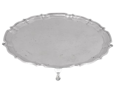 An Edwardian silver salverChester, 1910 by Barker Brothersplain circular from with piecrust border, on feet diameter 26cm., w