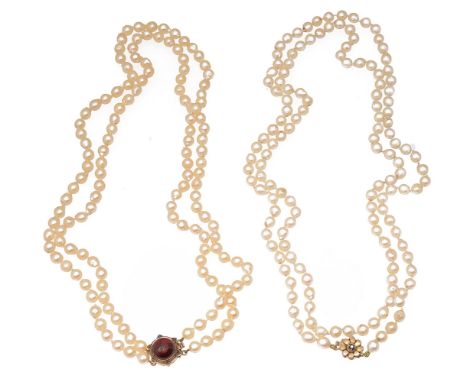 Two baroque cultured pearl necklacesone with a 19th century cabochon garnet and yellow gold anthemion circular clasp, the sec