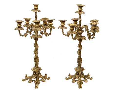 A pair of early Victorian Rococo Revival gilt metal six light fruiting vine candelabra c.1840twisted vine column with central