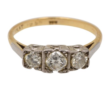 A diamond three stone ring the slightly graduated brilliant-cut diamonds box-set and pierced gallery  to the two coloured sha