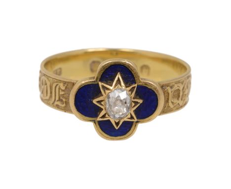 A mid Victorian  diamond and enamel memorial ring, the central oval old brilliant-cut diamond set within a star motif to the 