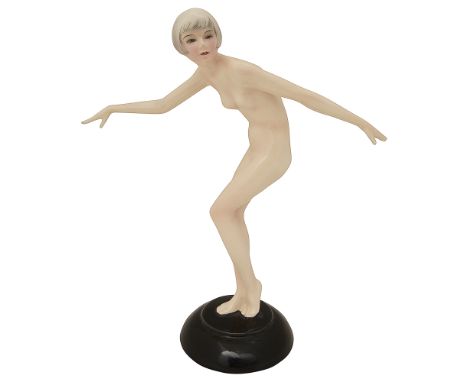 Lorenzl for Goldscheider. A pottery figurine of nude female dancer Model 5802 c.1930posed with outstretched arms, on a black 