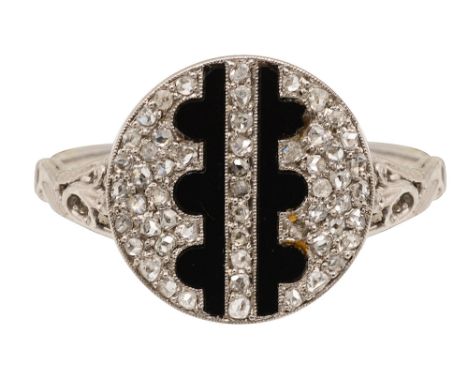 An onyx and diamond-set ringthe circular plaque pavé-set with rose-cut diamonds to the central onyx detailing, to the probabl