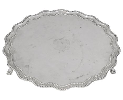 A late Victorian silver salverLondon, 1897 by R &amp; S Garrard &amp; Co.of plain circular form, raised wavy edged moulded be