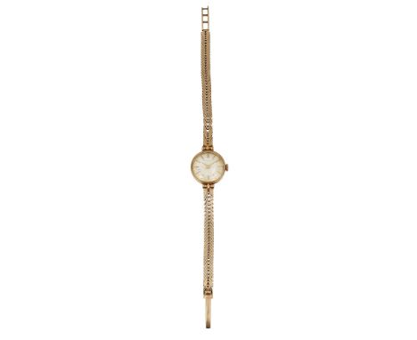 A lady's 9ct gold Garrard wristwatchcircular silvered sunburst dial with raised hour baton markers and gold hands, signed Gar