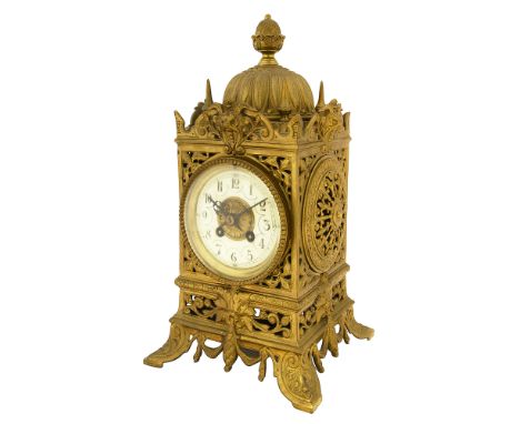 A late 19th century French lacquered brass mantel clock c.1900circular cream enamel dial with black Roman numerals, minute ma