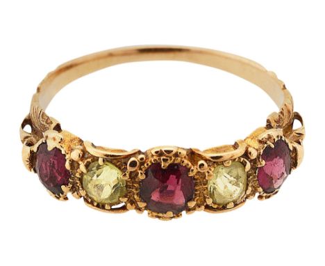 An early 19th century gem-set and yellow gold ringornately-set with three garnets and two chrysoberyl to the elaborate yellow