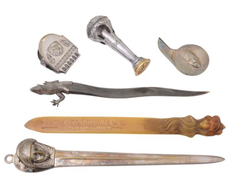 A Collection of continental Seccessionist and other desk items and letter openersto include a polished pewter desk seal of ta