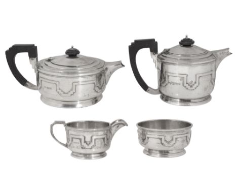 A George V Art Deco silver four piece tea service Sheffield, 1935 by Walker &amp; Hallof plain squat circular form with stepp