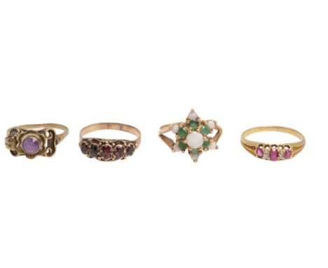 Four assorted rings: including  a ruby and diamond ring to the ridged tapering yellow gold shank; an opal and emerald tiered 