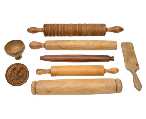 A group of 19th century kitchenaliato include: a thick glass rolling pin, the eight treen items to include, a fruitwood rolli