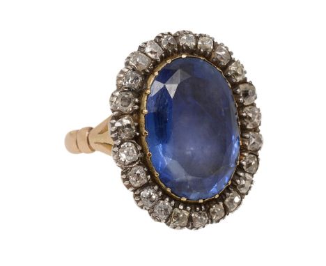 A Georgian sapphire and diamond-set cluster ring, the oval sapphire (possibly foiled) within a cut-down collet measuring 17.6