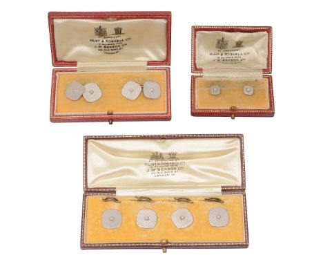 An Edwardian platinum, yellow gold and seed pearl dress setcomprising: a pair of cuff links with chain connections, four shir