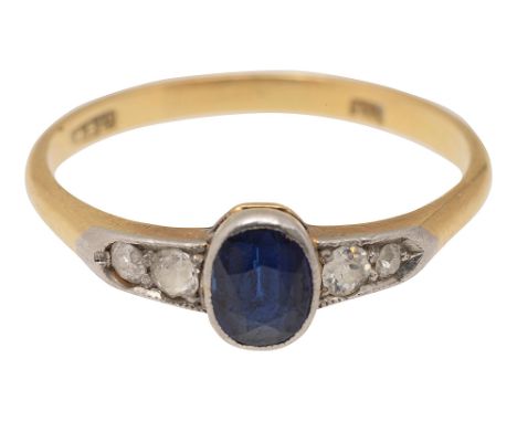 A sapphire and diamond-set ring the central collet-set oval mixed-cut sapphire with two graduated old-cut diamonds to either 