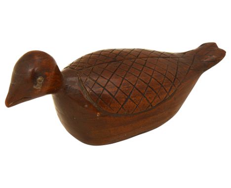 A 19th century treen bird snuff box with metal stud eyes, probably fruitwood10cm longCondition: In good order. The lid is a l