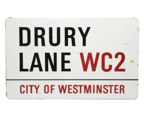 An enamelled iron street sign for Drury Lane WC2, City of Westminsterwith iconic black and red sans serif lettering first cre
