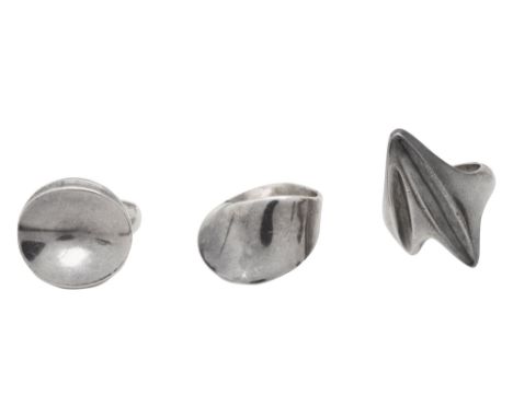 Three Georg Jensen silver rings comprising:Nanna Ditzel for Georg Jensen, circa 1970s, a silver concave disc ring with the de