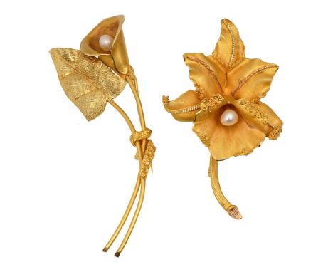 Two floral spray brooches one modelled as an arum lily with textured leaf, the second as a cattleya orchid, both with a seed 